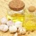 Use Garlic Oil for lifeless hair in changing seasons